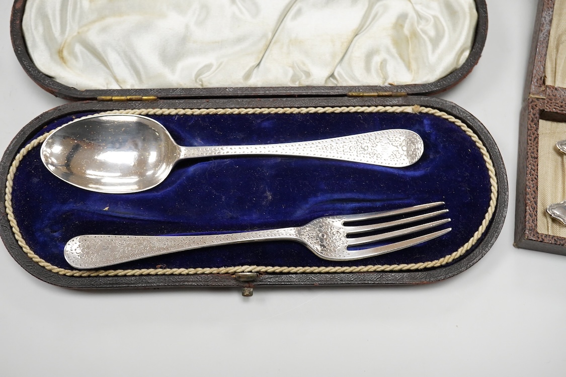 A cased Edwardian silver christening pair by Goldsmiths and Silversmiths Co Ltd, London, 1905, two cased sets of six silver teaspoons, one with a pair of sugar tongs, one other cased silver christening pair, a cased set